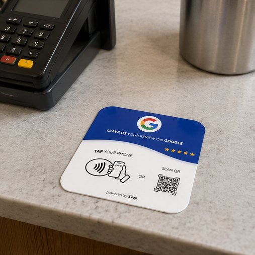 XTap review card placed beside a payment terminal