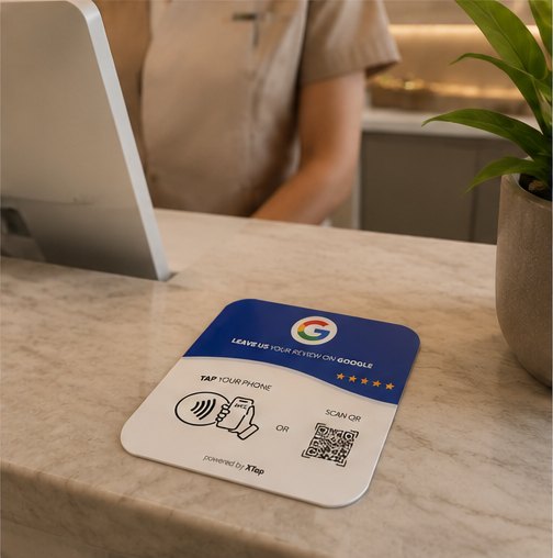 XTap review card on a front desk with staff nearby